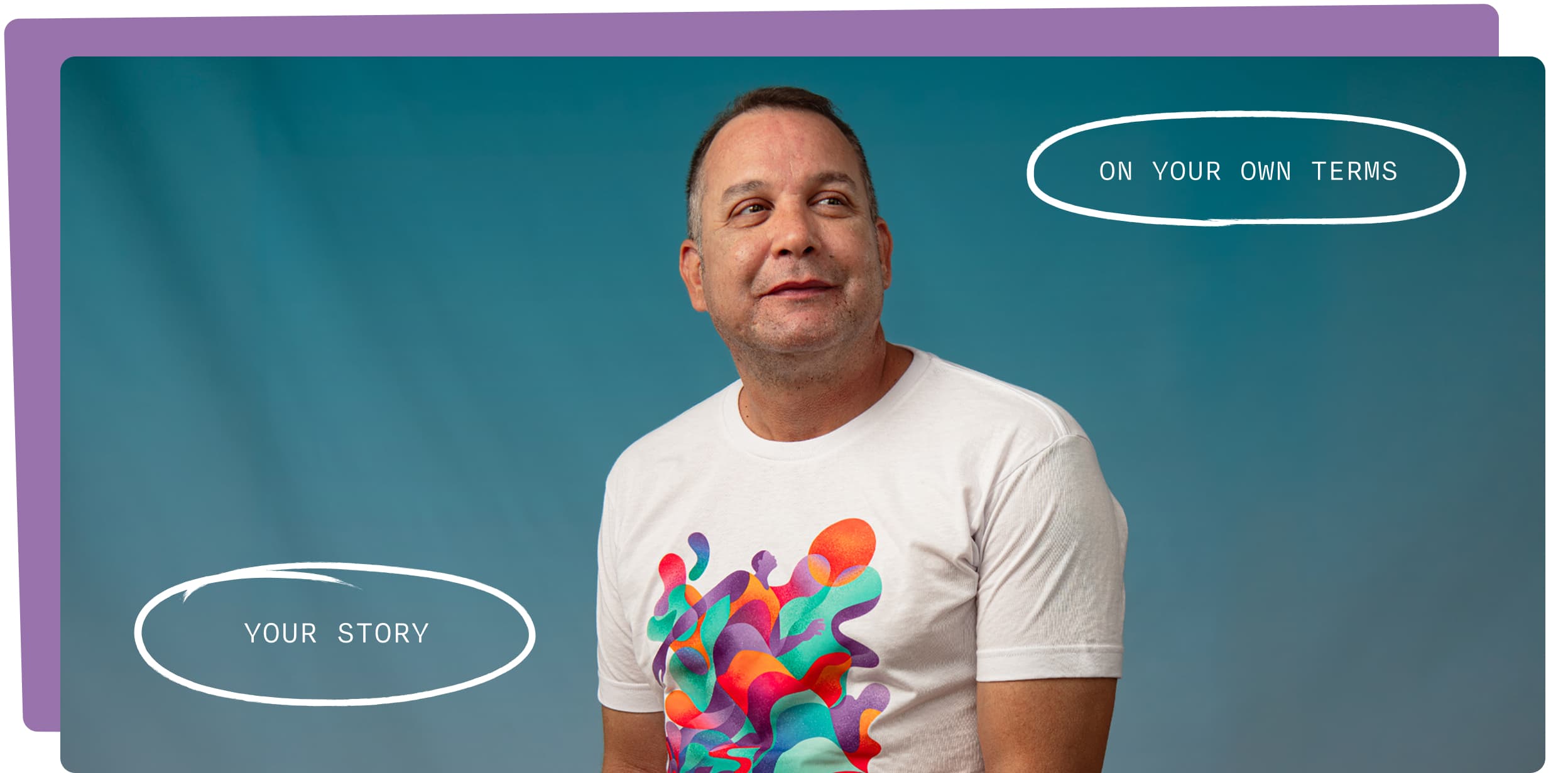 Man looking to the right and wearing a white t-shirt printed with colorful abstract artwork of figures and flowing shapes against a teal background