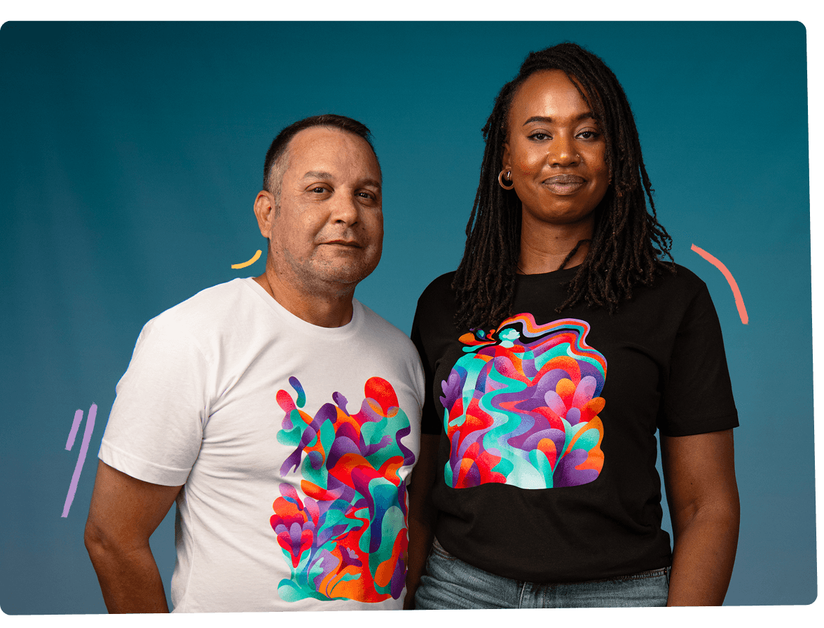Man in a white t-shirt and woman in
a black t-shirt standing side by side against a teal background. Each
t-shirt is printed with colorful abstract artwork of figures and flowing shapes.