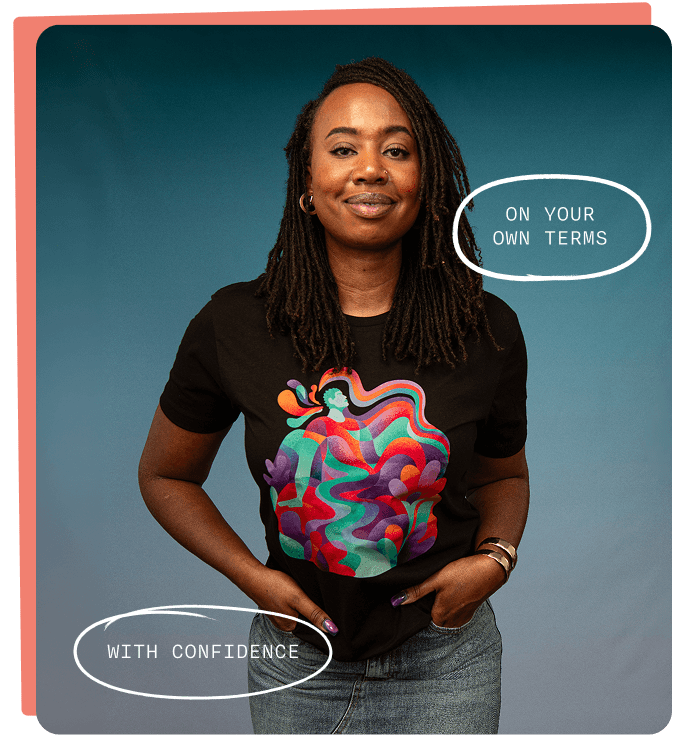 Smiling woman wearing a black t-shirt printed with colorful abstract artwork of figures and flowing shapes against a teal background